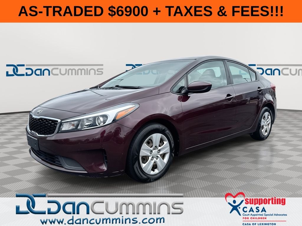 2018 Kia Forte LX in Garnet Red — front three-quarter view