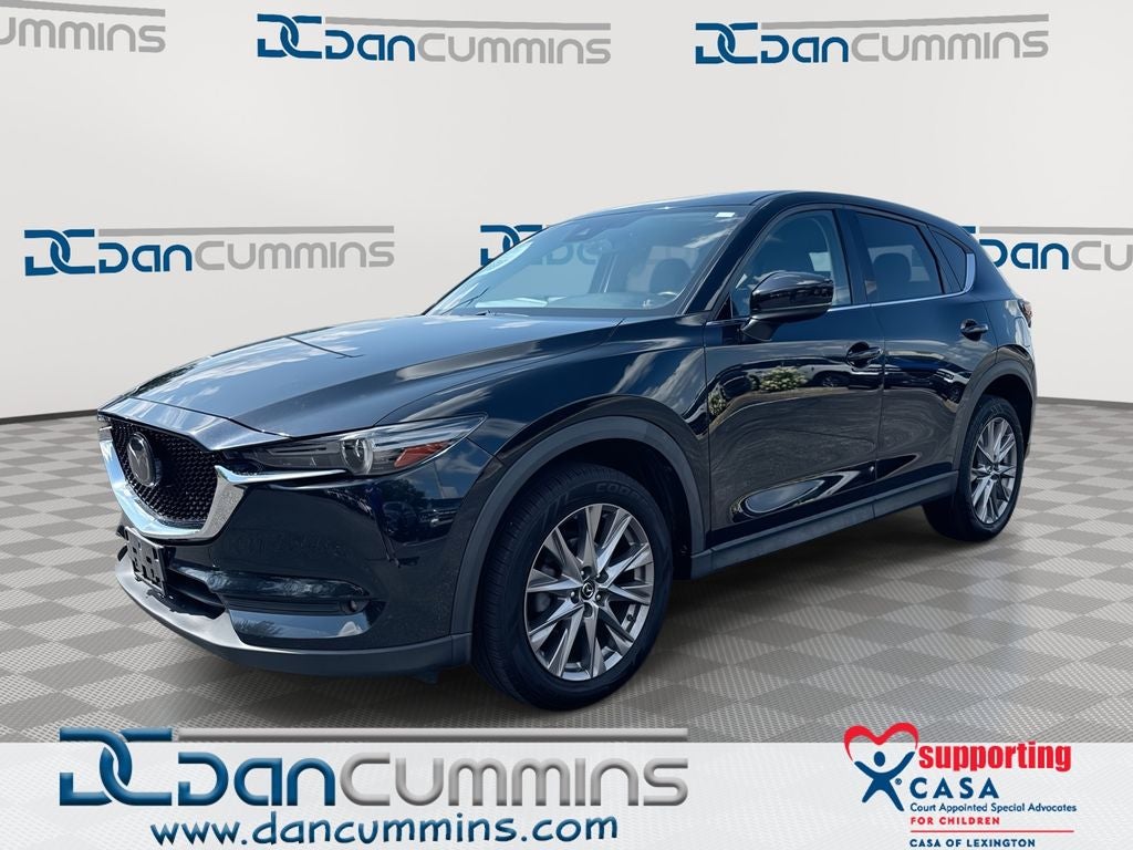 2019 Mazda Mazda CX-5 Grand Touring in Jet Black Mica — front three-quarter view