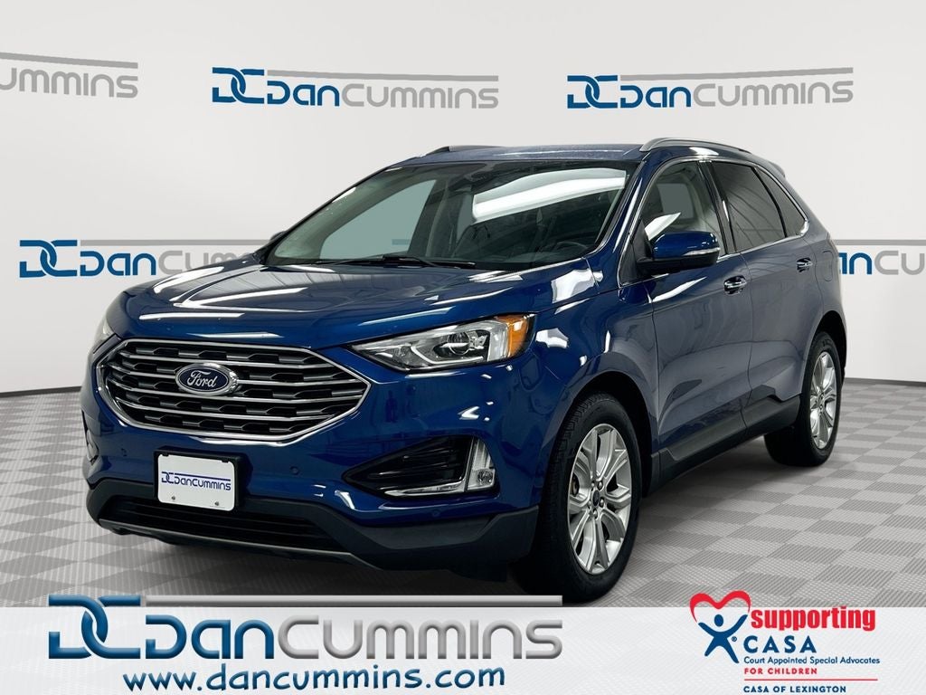 2020 Ford Edge Titanium in Blue Metallic — front three-quarter view