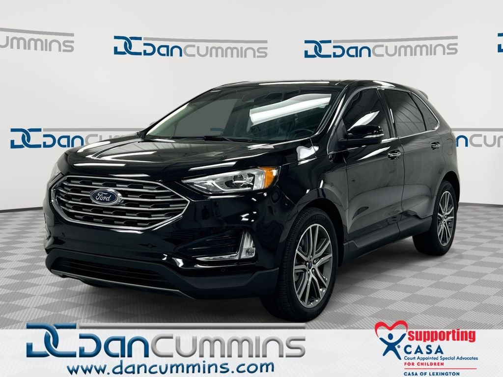 2021 Ford Edge Titanium in Black Metallic — front three-quarter view