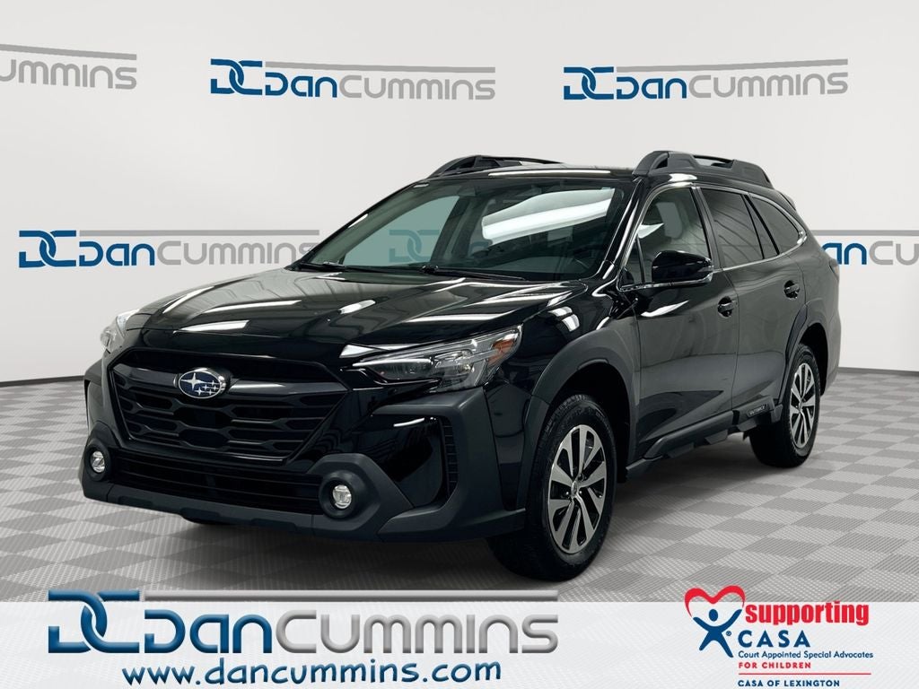 2023 Subaru Outback Premium in Crystal Black Silica — front three-quarter view