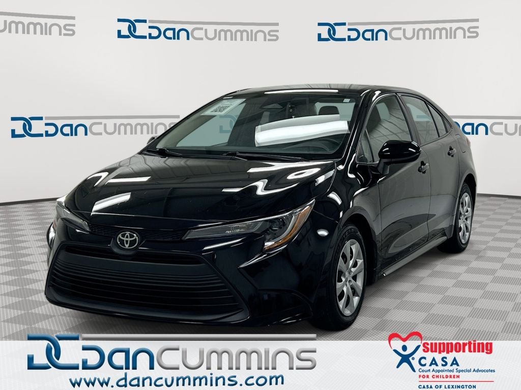 2024 Toyota Corolla LE in Midnight Black Metallic — front three-quarter view