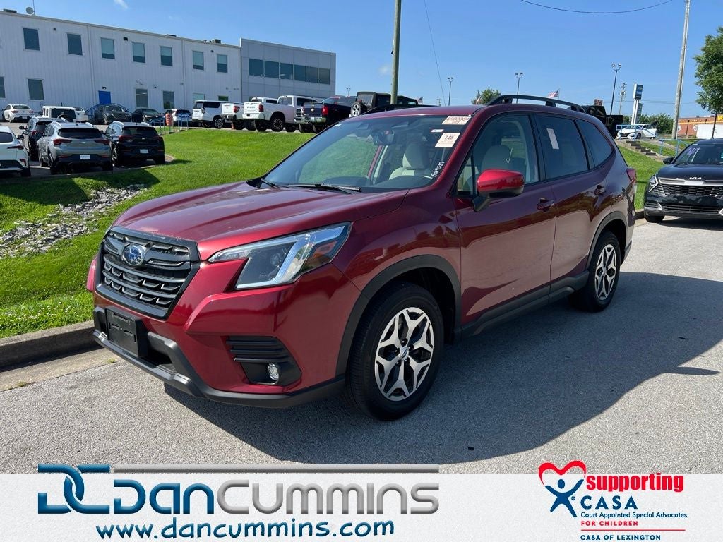 2024 Subaru Forester Premium in Crimson Red Pearl — front three-quarter view