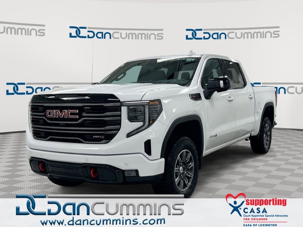 2025 GMC Sierra 1500 AT4 in Summit White — front three-quarter view