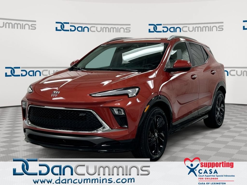 2024 Buick Encore GX Sport Touring in Sunrise Red Metallic — front three-quarter view