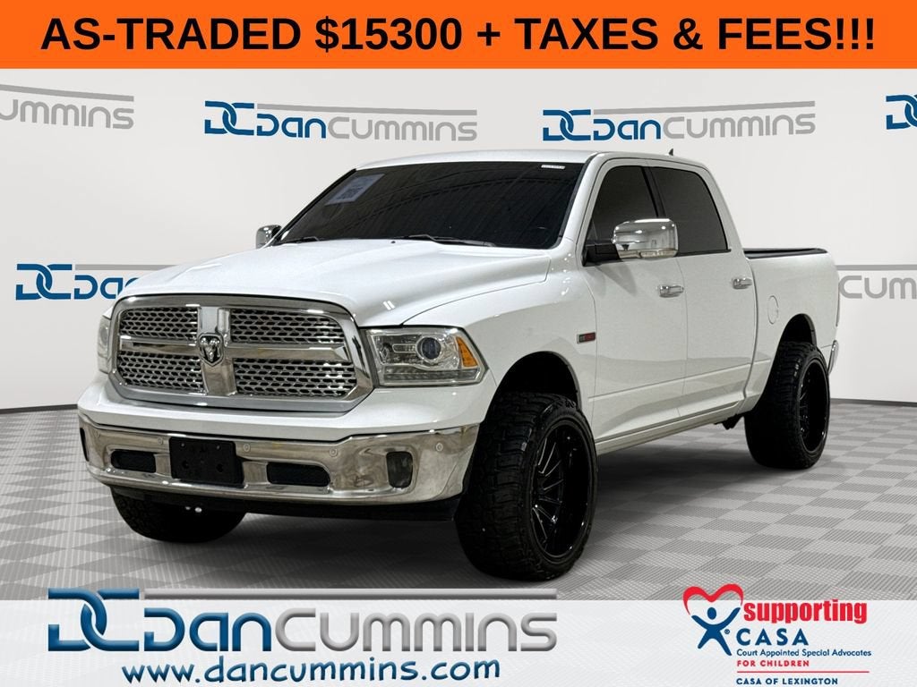 2016 RAM 1500 Laramie in White — front three-quarter view