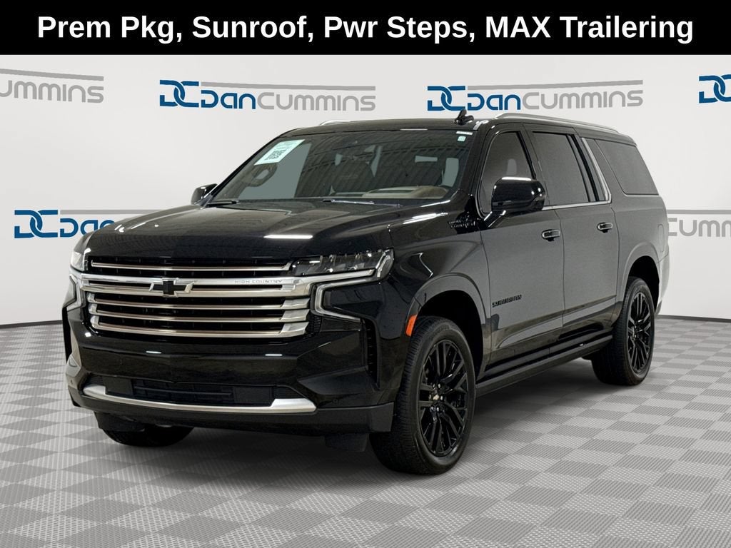 2024 Chevrolet Suburban High Country in Black — front three-quarter view