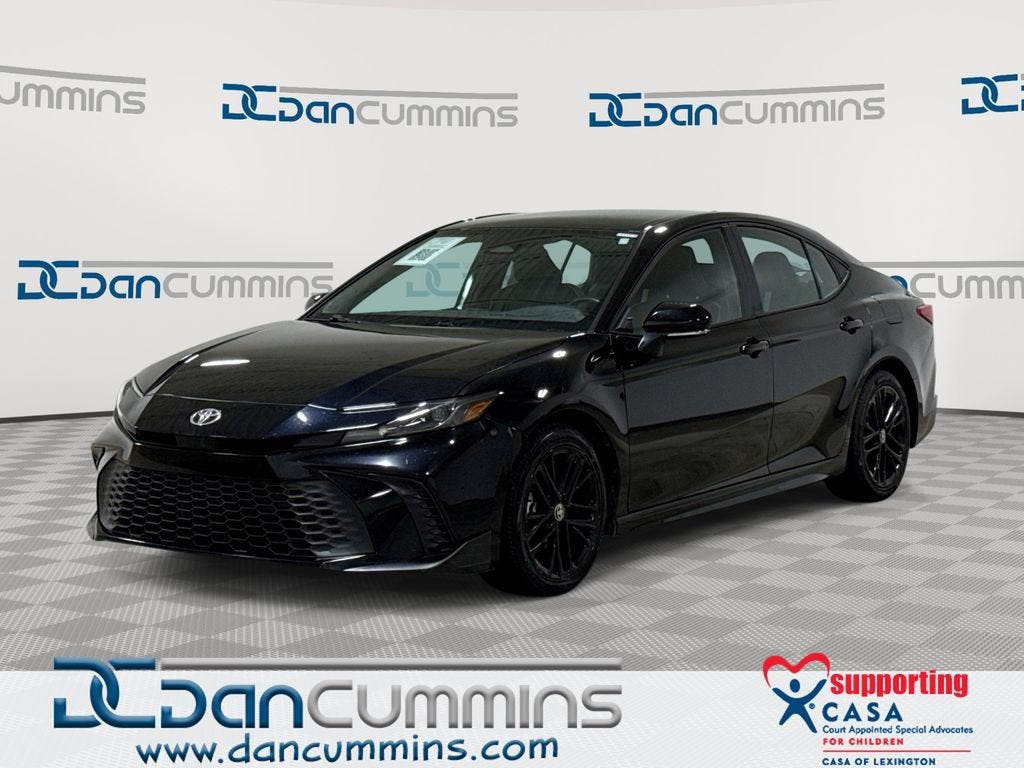 2025 Toyota Camry LE in Black — front three-quarter view