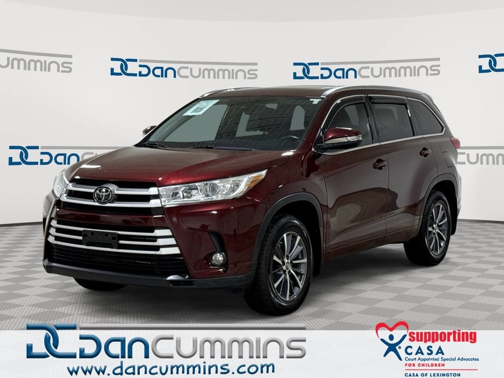 2018 Toyota Highlander SE in Red — front three-quarter view